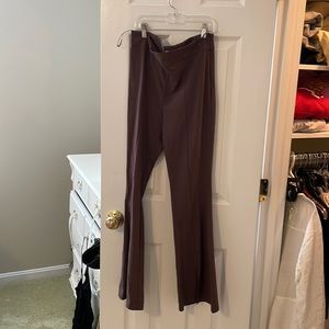 Brown yoga style work pants with slit in the from at the bottom